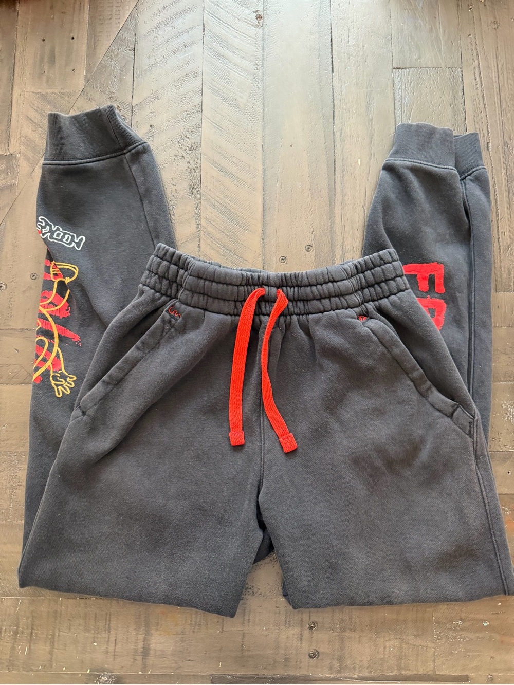 Nike Black Sweatpants with Red Drawstring and Graphics